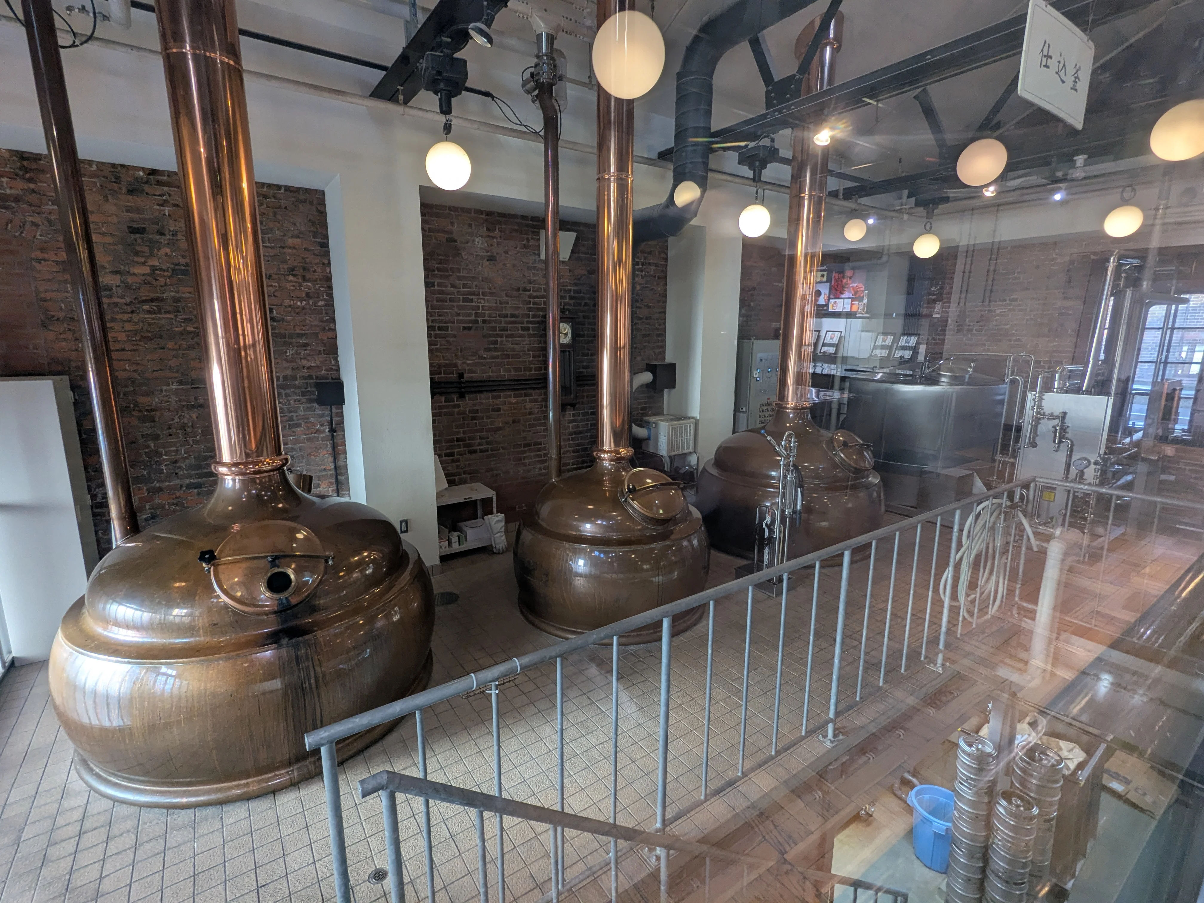 Brewing kettles and filtration tanks inside the exhibition hall