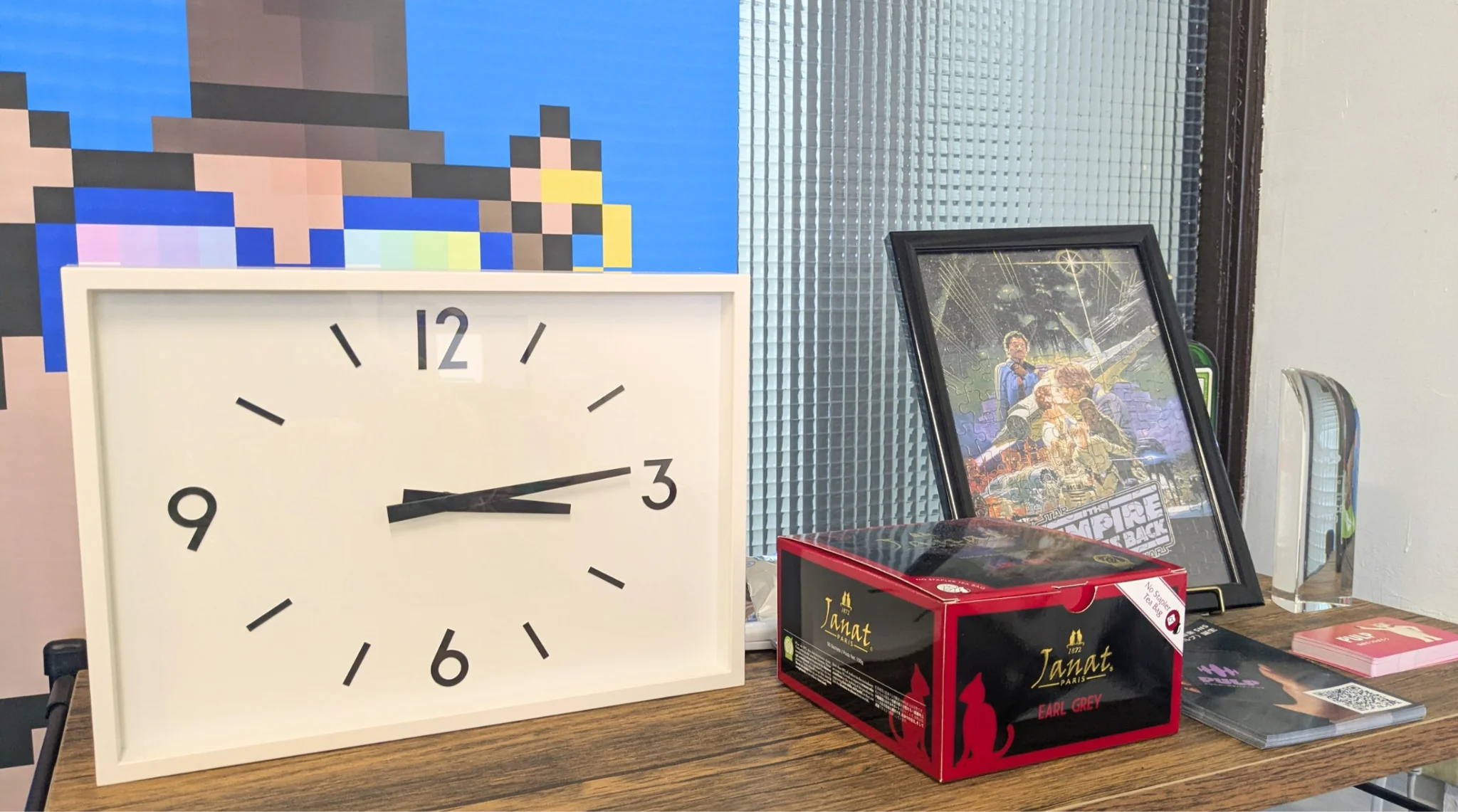 Space beside the refrigerator with puzzle and product flyers